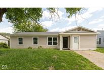 Charming single-story home with a well-maintained lawn and inviting front entrance at 2519 N Boehning St, Indianapolis, IN 46219