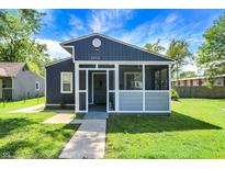 Charming home with a quaint front porch and beautiful lawn at 2936 N Gladstone Ave, Indianapolis, IN 46218
