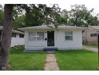 Charming single-story home featuring a minimalist design and a well-maintained front yard at 4353 Evanston Ave, Indianapolis, IN 46205