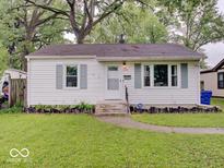 Charming home featuring a well-maintained lawn and lovely landscaping at 4415 N Longworth Ave, Indianapolis, IN 46226