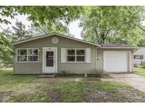 Charming single-story home with neutral siding, a garage, and a well-maintained front yard at 521 Elmhurst Pl, Whiteland, IN 46184