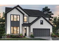 Charming two-story home showcasing white siding, black trim, and a two-car garage at 6338 Rippling Rock Dr, Plainfield, IN 46168