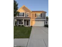 Two-story home with a well-manicured lawn and a two-car attached garage at 8241 Morera Ct, Indianapolis, IN 46237