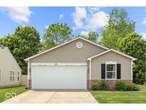 Charming single-story home with a two-car garage and well-maintained front yard, nestled in a quiet neighborhood at 11821 Wapiti Way, Noblesville, IN 46060