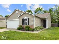 Charming single-story home featuring light siding, an attached garage, and a well-maintained lawn at 11821 Wapiti Way, Noblesville, IN 46060