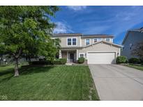 Charming two-story home with a well-manicured lawn and inviting curb appeal on a sunny day at 15710 Chapel Park E Dr, Noblesville, IN 46060