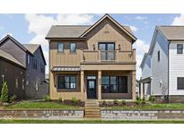 Charming two-story home featuring a second story balcony and professional landscaping at 1664 Carrollton Rail Dr, Westfield, IN 46074