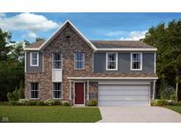 Two-story brick home featuring blue siding, a two-car garage, red front door, and a well-manicured lawn at 331 Oxford Ln, Lebanon, IN 46052