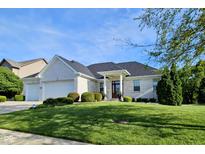Charming single-story white brick home featuring a well-manicured front lawn at 5347 Sampson Dr, Indianapolis, IN 46237