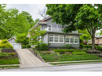 Beautiful two-story home with well-manicured landscaping and a charming balcony at 5430 N Washington Blvd, Indianapolis, IN 46220