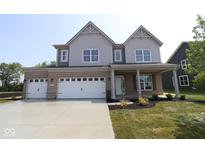 Charming two-story home with a three-car garage and a beautifully landscaped front yard at 5517 Sienna Ct, Brownsburg, IN 46112