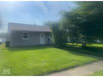 Charming single story home with well-maintained lawn, mature tree and neutral color at 1205 Meadow Ln, Lebanon, IN 46052