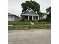 Charming single-Gathering home featuring a quaint porch and a well-maintained front yard at 1524 W 21St St, Indianapolis, IN 46202