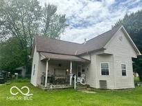 Charming single-Gathering home featuring a welcoming front porch, well-maintained lawn, and classic architectural details at 162 N Gladstone Ave, Columbus, IN 47201