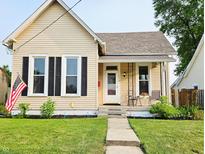 Charming single-story home with a well-manicured lawn and inviting front porch, perfect for enjoying the outdoors at 179 E Pearl St, Greenwood, IN 46143