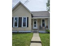 Charming single-story home featuring a cozy front porch and well-maintained landscaping at 179 E Pearl St, Greenwood, IN 46143