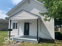 Charming single-Gathering home featuring a quaint front porch and well-maintained siding at 1820 S M St, Elwood, IN 46036
