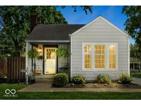 Charming single-story home with a cozy front porch and well-maintained landscaping at 2521 Mcleay Dr, Indianapolis, IN 46220