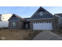 Inviting new construction home with charming brick facade and attached two-car garage at 4290 Ironclad Dr, Bargersville, IN 46106