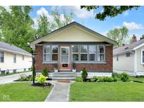 Charming brick bungalow with a well-maintained front yard and a cozy, inviting entrance at 6045 Dewey Ave, Indianapolis, IN 46219