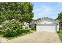 Charming single-Gathering home with a well-manicured lawn and attached two-car garage at 8446 S Paddleboat Ln, Pendleton, IN 46064