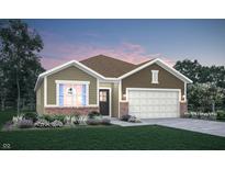 Inviting one-story home featuring a brick-accented facade, complemented by a pristine lawn and manicured landscaping at 8727 Marietta Ln, McCordsville, IN 46055