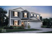 Charming two-story home with gray siding, a two-car garage, and professional landscaping at 8838 Alexander Ridge Dr, McCordsville, IN 46055