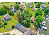 Expansive waterfront property with a private dock and a charming deck, perfect for enjoying scenic views at 1240 Stringtown Pike, Cicero, IN 46034