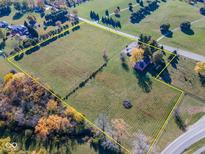 Expansive aerial view of land showing the property boundaries and adjacent greenery at 13518 (3 Lots) Promise Rd, Fishers, IN 46038