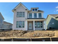New two-story brick home featuring black-framed windows and a covered front porch with white pillars at 15344 Cardonia Rd, Fishers, IN 46037