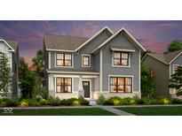 Beautiful two-story home with gray siding, black trim windows, and professionally landscaped front yard at 15360 Cardonia Rd, Fishers, IN 46037