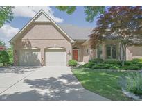 Charming brick home featuring a well-manicured lawn and a convenient two-car garage at 1858 Broadleaf Ct, Greenwood, IN 46143