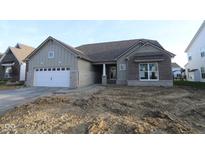 Charming single-Gathering home with stone accents, attached two car garage, and covered front entry at 4250 Ironclad Dr, Bargersville, IN 46106