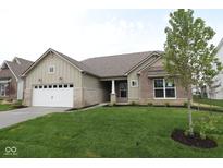 Charming single-story home with a well-manicured lawn and attached two-car garage at 4250 Ironclad Dr, Bargersville, IN 46106