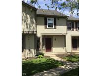 Inviting townhouse featuring neutral siding, dark shutters, and well-maintained landscaping at 6070 Southbay Dr, Indianapolis, IN 46250