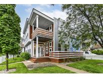 Striking two-story townhouse showcasing modern architecture and well-maintained landscaping at 902 Woodlawn Ave, Indianapolis, IN 46203