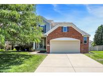 Charming two-story home with a brick facade and well-manicured lawn at 14499 Milton Rd, Fishers, IN 46037