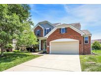 Charming two-story home with a brick facade and well-manicured lawn at 14499 Milton Rd, Fishers, IN 46037