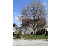 Charming two-story home with mature tree offering shade and curb appeal at 2208 S F St, Elwood, IN 46036