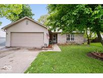 Charming single-story home with a brick facade, attached garage, and a well-maintained front yard at 4016 Dogwood Ln, Franklin, IN 46131