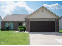 Charming single-story home with brick and siding, featuring a two-car garage and well-maintained lawn at 540 Cahill Ln, Indianapolis, IN 46214