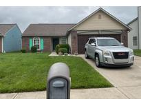 Charming brick home with manicured lawn, attached garage, and decorative shutters at 540 Cahill Ln, Indianapolis, IN 46214