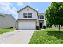 Charming two-story home featuring a two-car garage, well-maintained lawn, and traditional design elements at 10431 Bellchime Ct, Indianapolis, IN 46235