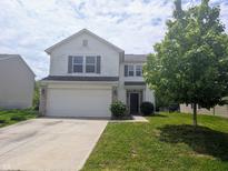 Charming two-story home featuring an attached two-car garage and a well-manicured front lawn at 10431 Bellchime Ct, Indianapolis, IN 46235