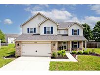 Charming two-story home with blue shutters and attached two-car garage at 1222 Grand Canyon Ct, Franklin, IN 46131