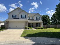Charming two-story home with a well-manicured lawn and a two car garage at 1222 Grand Canyon Ct, Franklin, IN 46131