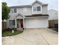 Two-story home with neutral siding, a red front door, and an attached two-car garage at 2637 Grand Fir Dr, Greenwood, IN 46143