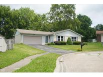 Charming single-story home with a well-maintained front yard and a two-car garage at 3612 Carolee Ct, Indianapolis, IN 46227