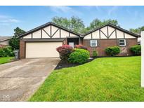 Charming brick home with a well-manicured lawn and fresh landscaping at 4701 Candy Spots Dr, Indianapolis, IN 46237