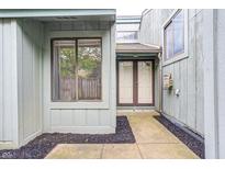 Inviting entrance with double doors, window, and black mulch landscaping at 5097 Vantage Point Rd # B 2, Avon, IN 46123
